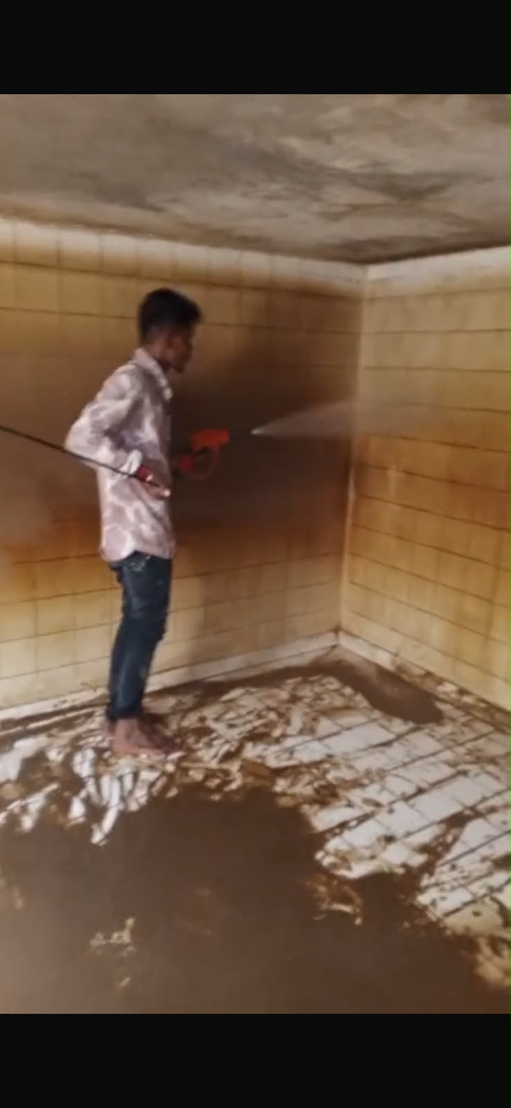 Large tiled water storage tank during pressure cleaning
